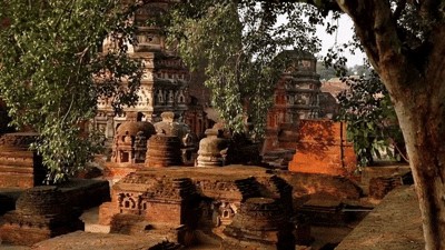 Ancient brick stupas and ruins at Nalanda among trees