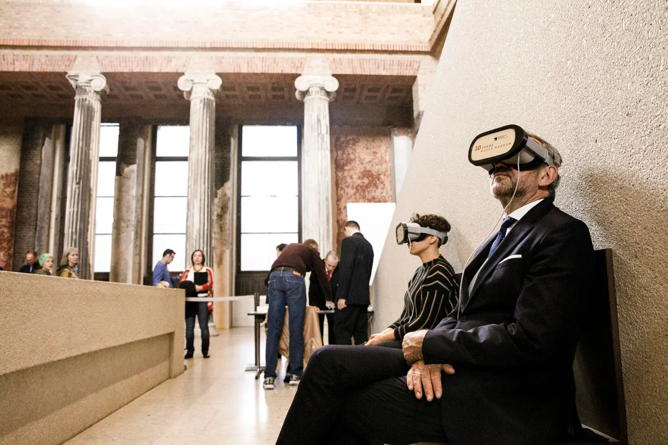 Student wearing a VR headset among museum display cases